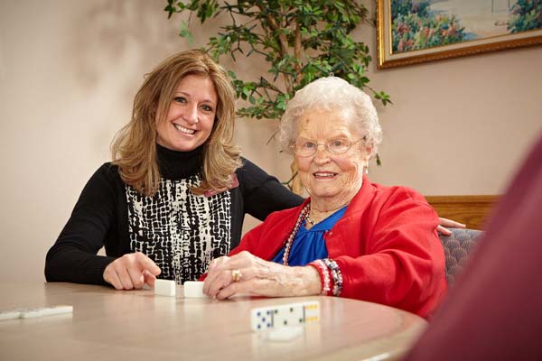 patient and employee playing dominos