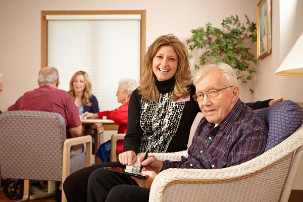 Nurse sitting with patient