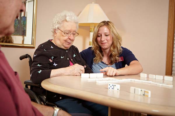 Nurse playing dominos with patient